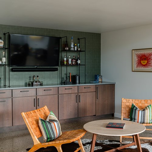 Scandinavian style seating area with funky accent rug