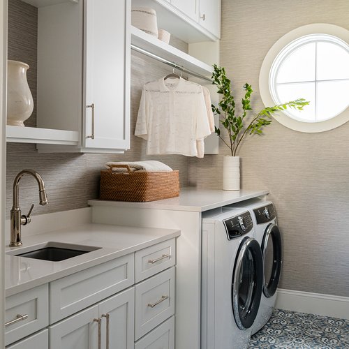 Stylish laundry room by Michigan Tile Inc